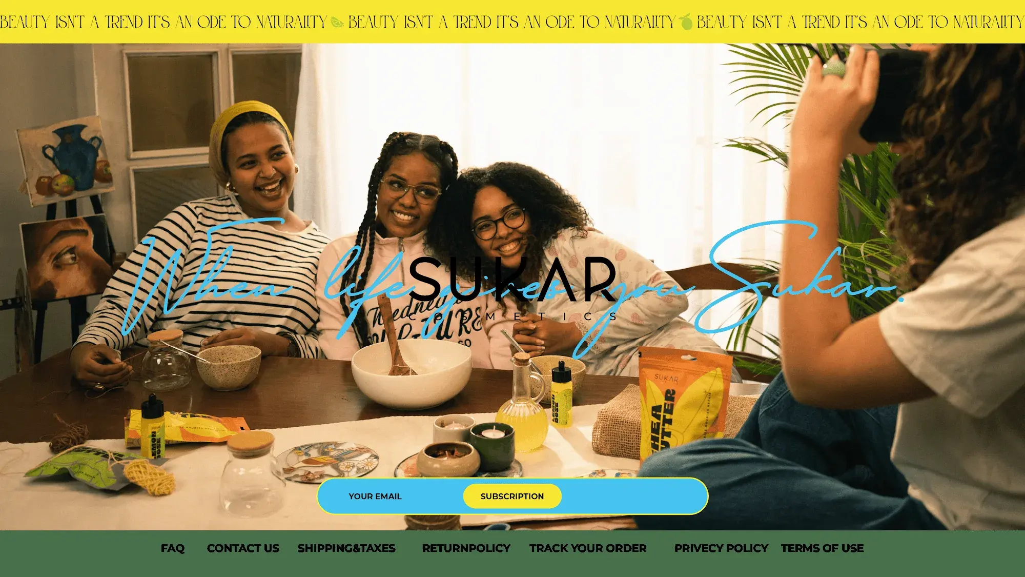 Sukar website: women cooking together under When life gives you Sukar